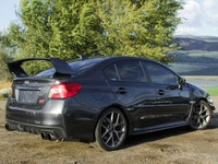 Feel the thrill of the road with the 2017 Subaru WRX STI Sport, finished in a striking shade of gray... (image 2)