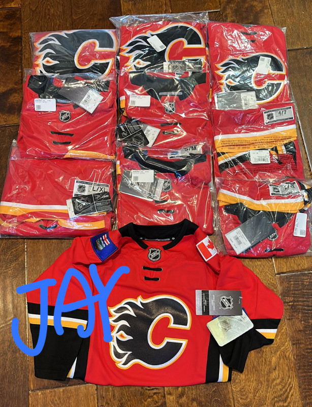 Brand New in Bag w/ TAGS Calgary Flames NHL Jersey for all ages in Men's in Calgary - Image 2
