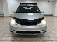 Silver light glances off the Titanium Metallic paint as it moves, the compact hatchback shape cuttin... (image 7)