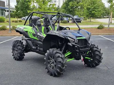 Purpose-built for mud with tall, aggressive rubber, snorkeled intake/CVT ducting, and suspension tra...