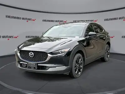 // ACCIDENT FREE!! // Finished in Black with a Burgundy interior, this used 2022 Mazda CX-30 GT w/Tu...