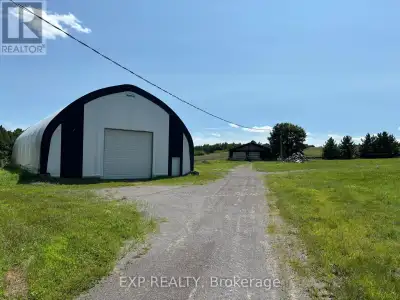 11-acre property which features a 50 ft x 80 ft (approx.) industrial coverall as well as a solid and...