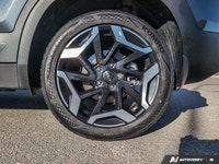 The 2025 Kia Seltos X-Line AWD in a striking gray finish with an automatic transmission offers confi... (image 6)