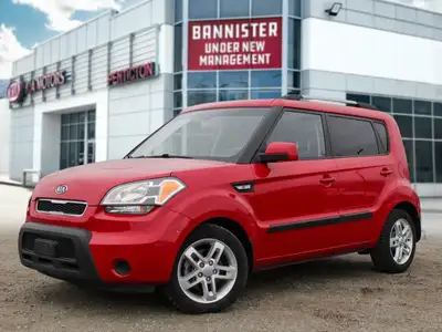 The 2011 Kia Soul 2u in a vibrant red with front-wheel drive is a vehicle built for handling the dem...