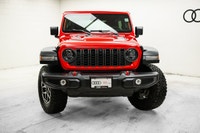 Why buy new? Save over $13,800 + tax from new on this ultra low KM 2026 Jeep Wrangler 4-Door 4x4 Rub... (image 1)