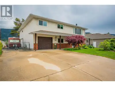 Stunning River View! Discover this generously sized family home nestled in the highly sought-after s...