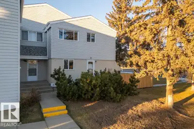 Welcome to 39 McLeod Place NW — a BRIGHT, WARM, FAMILY-FRIENDLY townhome with a COMFORTABLE layout a...