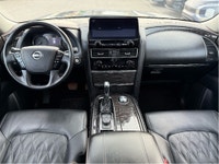The 2023 Nissan Armada 4x4 Platinum in a striking black finish is a powerhouse SUV designed for both... (image 9)