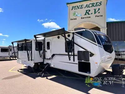 Keystone Cougar Half-Ton travel trailer 29RLP highlights: King Bed Full Bath Kitchen Island Two 10'...