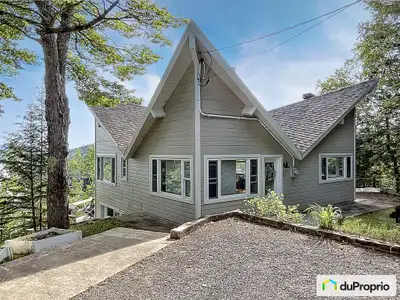 Chalet à vendre au BORD DE L'EAU et en montagne! LOCATION COURT TERME POSSIBLE! Niché dans la montag...