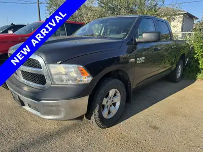 The 2014 Ram 1500 Crew Cab 5.7 Ft Box ST is a powerful and versatile gray 4x4 truck, perfect for tac...