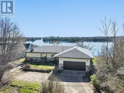 Opportunity knocks with this in-town lakefront property that's ready for a refresh. The lot is truly...