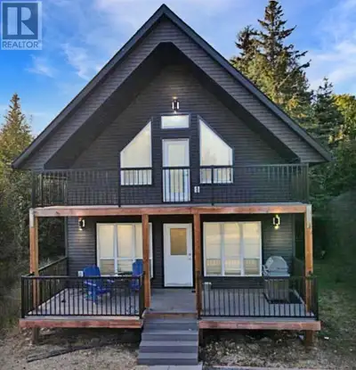 1350 sq ft 2 storey Modern Cabin in the gated community of Hilliards Bay Estates. The Cabin has a br...