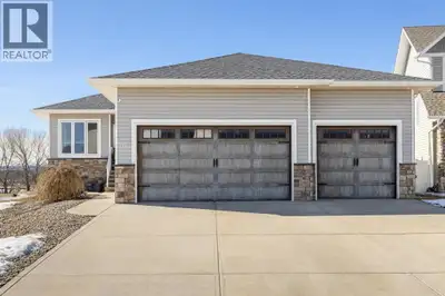 Incredible opportunity in Blackfalds! This impressive walkout bungalow was thoughtfully built as a l...