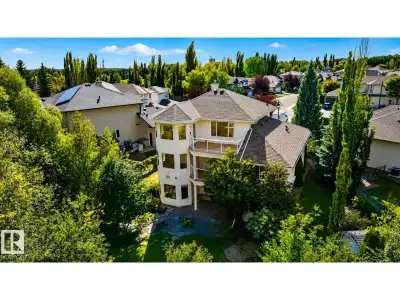 Set on a large pie-shaped lot, this estate offers privacy, generous outdoor space and views of the L...