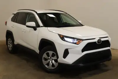The 2021 Toyota RAV4 LE AWD in striking White is built for those who value reliable performance and...