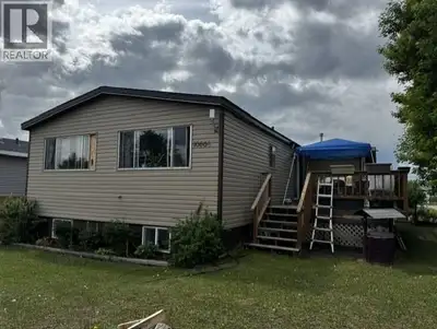 Welcome to this affordable double-wide manufactured home with a full basement on its own corner lot,...