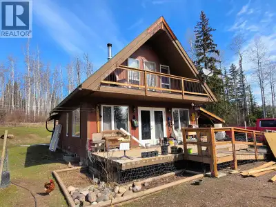Quiet and private rural 5 acres approximately 40 minutes from Smithers. The cottage style home featu...