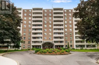 AN END CORNER UNIT WITH A VIEW! This spacious 2 bedroom condo has an amazing view of a mature treed...