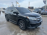New Arrival! Drive home comfort, space, and reliability in this 2019 Honda Pilot Touring 8 Passenger... (image 9)