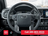 The 2019 Toyota Tacoma TRD Off Road 4x4 Double Cab V6 in a stunning white color with a robust 4x4 dr... (image 9)