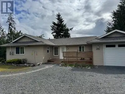 Private location in Little Qualicum Village! This 3-bedroom home offers a versatile layout with 2 be...