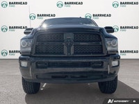 The 2016 Ram 2500 Laramie, finished in an elegant black exterior paired with a sophisticated black i... (image 1)
