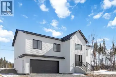Introducing a thoughtfully designed new-construction split entry, offering modern design and a funct...