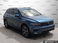 This Volkswagen Tiguan boasts a Intercooled Turbo Regular Unleaded I-4 2.0 L/121 engine powering thi... (image 7)