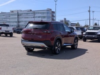 This pre-owned 2023 Nissan Rogue Platinum is finished in a beautiful Red paint with a refined Graphi... (image 6)