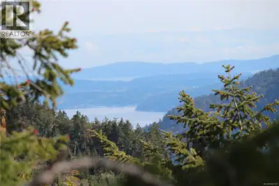5.12 acres n a quiet area near the end of Goldstream Heights Drive. Vast ocean, city, mountain and v...