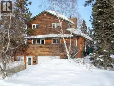 Contemporary home with garage on greenbelt lot with panoramic vista of Yukon River Valley. Open conc...