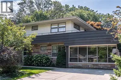 Magnificent Mid-Century Modern on quiet court near Cootes. Cherished by the original owners for 69 y...