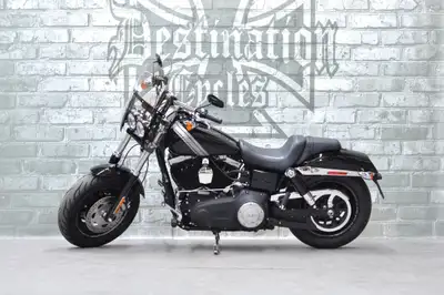 ONLY 7902 km on this very nice, one owner, 2016 Dyna Fat Bob! A few nice upgrades like a quick detac...