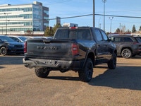 The 2026 Ram 1500 Rebel Crew Cab in Granite Crystal Metallic makes a bold statement with its rugged... (image 6)