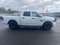 The 2022 Ram 1500 Classic Express, presented in a pristine white finish, is equipped with a robust 4... (image 4)