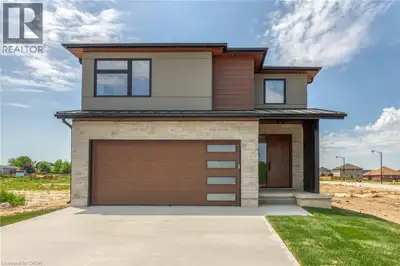 To Be Built - This impressive 2,497 sq. ft. home combines striking curb appeal with modern elegance,...