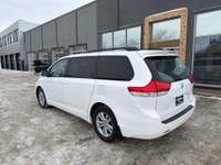 This 2014 Toyota Sienna LE in classic white is a proven, family-friendly minivan known for outstandi... (image 2)