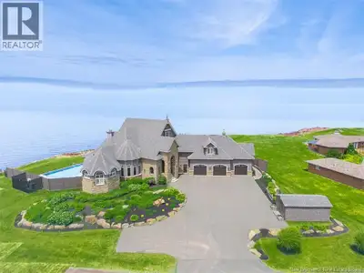 Experience elevated coastal living in this breathtaking waterfront home set on 1.42 acres of private...