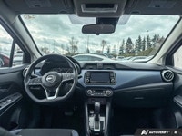 Designed for efficiency and confident urban navigation, this vibrant red 2024 Nissan Versa SV, is yo... (image 8)