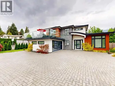 Exceptional custom-built residence in the prestigious Edgemont neighborhood offering over 6,200sqft...