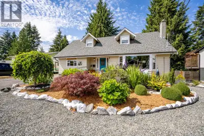 Step into turn key living in highly sought after Puntledge Park! Set on a spacious 0.2 acre lot, thi...