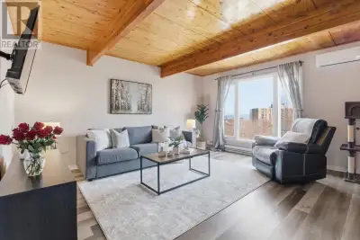 Townhouse-style condo with private front entrance and fully fenced backyard, offering a functional 3...