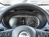 The former daily rental 2024 Nissan Versa SV, dressed in an eye-catching Aspen White TriCoat, presen... (image 7)