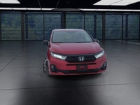 The 2025 Honda Odyssey Black Edition in a striking Red finish, equipped with a Front-Wheel Drive, of... (image 2)
