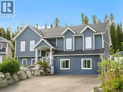 The perfect home for a large family with detached Quonset garage/shop, and a legal suite for in-laws...