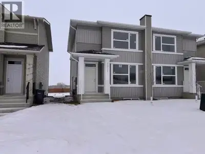 This well designed two storey duplex offers over 1,300 square feet of thoughtfully planned living sp...