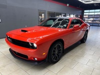 Meet the 2022 Dodge Challenger GT in a vibrant orange finish, gracefully combined with an AWD drivet... (image 2)