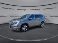This used 2018 Honda Pilot Touring AWD is a roomy, family-ready SUV with smart features and proven V... (image 3)