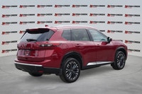 The 2025 Nissan Rogue Platinum, in striking Red, offers a sophisticated driving experience with only... (image 5)